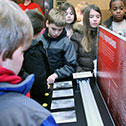 Image of students exploring interactive display in the Visitor Education Center.